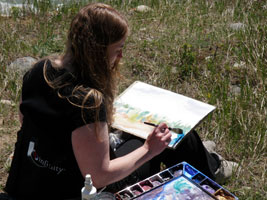 Kendra painting as part of the Artist in Residence program at Mountain Galleries in Jasper, Alberta