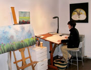 Carrie painting in Studio